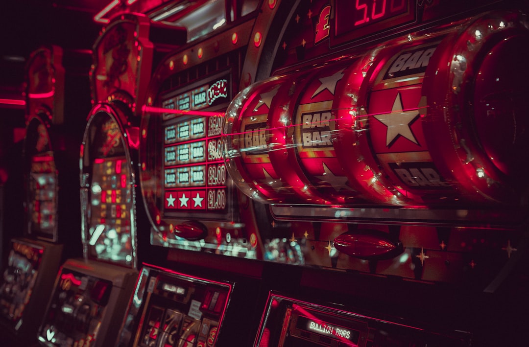 Close-up view of vintage slot machines with vibrant lights and symbols in a casino setting