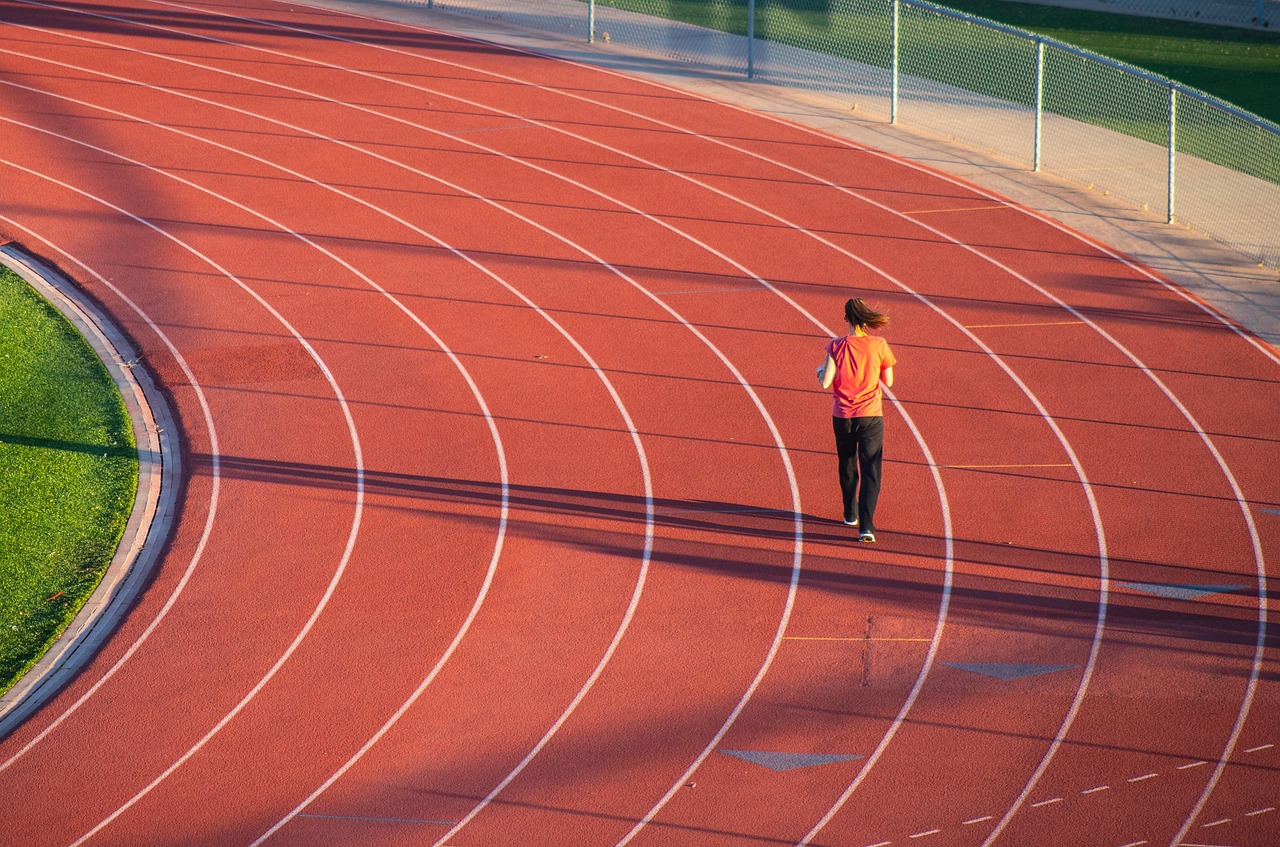 Running, woman, track — The Medicare Advantage Advantage: Maximizing Your Benefits
